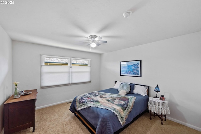 bedroom featuring baseboards, ceiling fan, and carpet