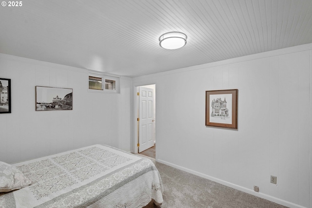 bedroom featuring carpet floors and baseboards