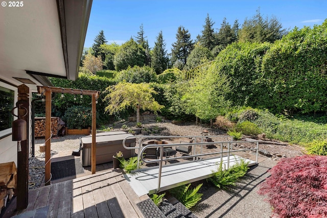 exterior space featuring a hot tub and a deck