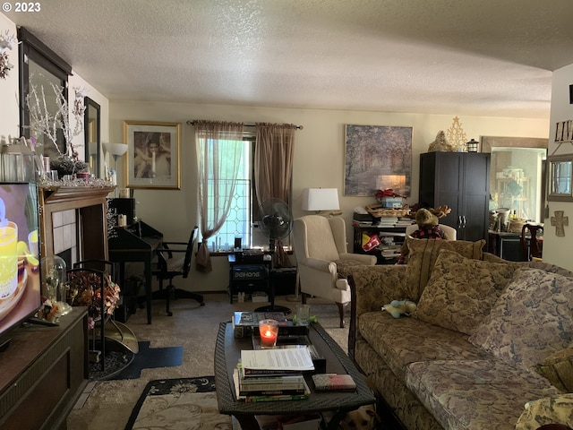 carpeted living room featuring a textured ceiling and a fireplace