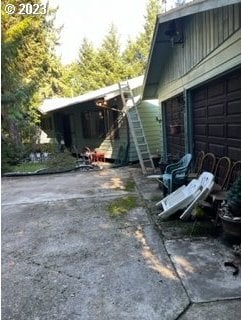 exterior space featuring a garage and driveway