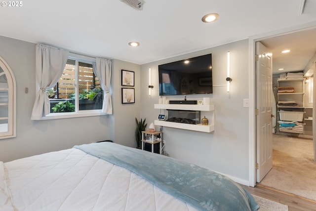 bedroom featuring hardwood / wood-style floors