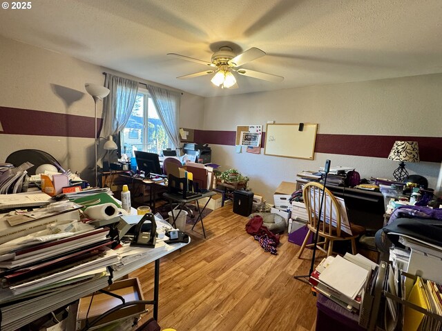 office with hardwood / wood-style floors, a textured ceiling, and ceiling fan