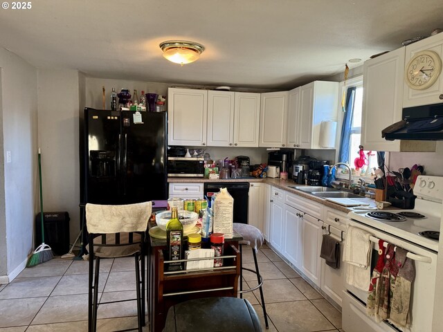 kitchen with black appliances, white cabinets, light tile patterned floors, and sink