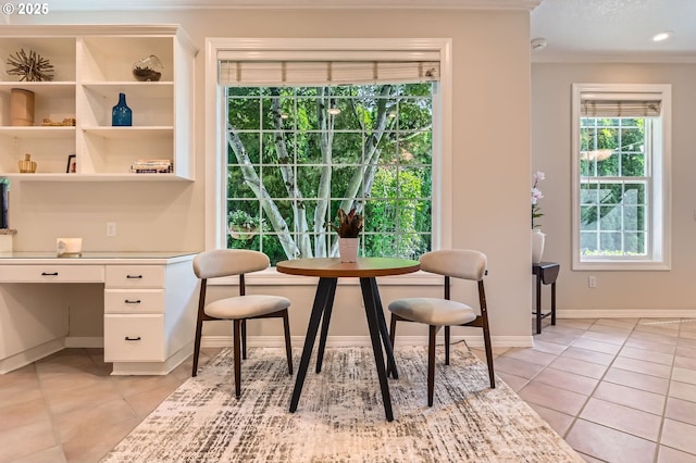 17472 NW Gilbert Ln, Portland, OR 97229 - dining room featuring crown molding, light tile patterned floors, and baseboards