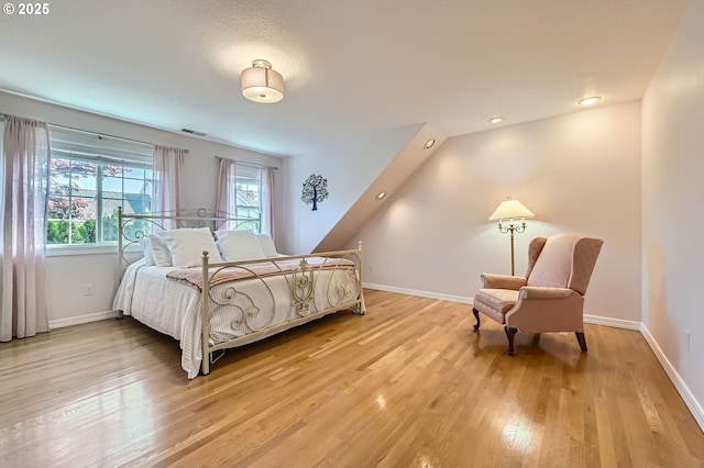 17472 NW Gilbert Ln, Portland, OR 97229 - bedroom featuring light wood-style floors and baseboards