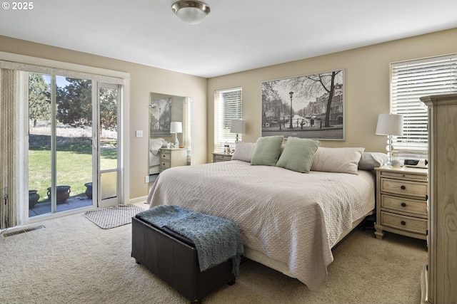 2057 SE Blue Skies Ln, Prineville, OR 97754 - bedroom featuring carpet flooring, access to exterior, and multiple windows