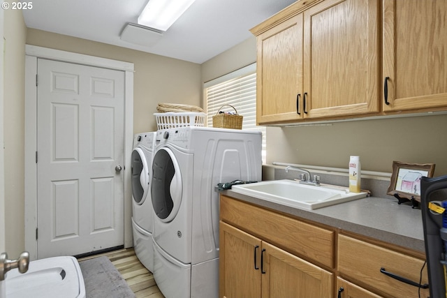 2057 SE Blue Skies Ln, Prineville, OR 97754 - washroom featuring cabinet space, separate washer and dryer, and light wood-style floors