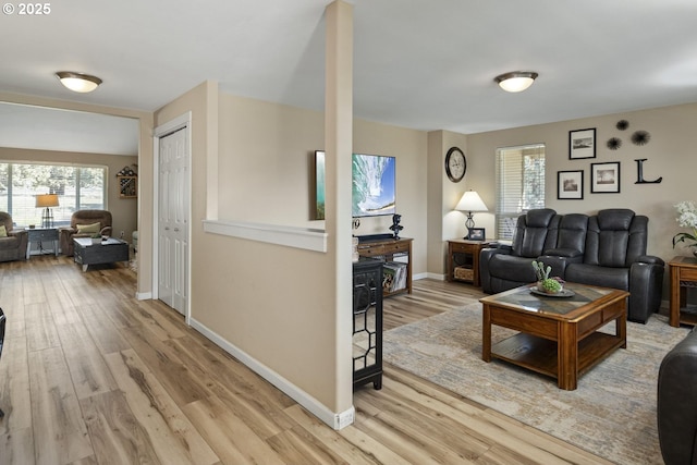 2057 SE Blue Skies Ln, Prineville, OR 97754 - living area with wood finished floors, healthy amount of natural light, and baseboards