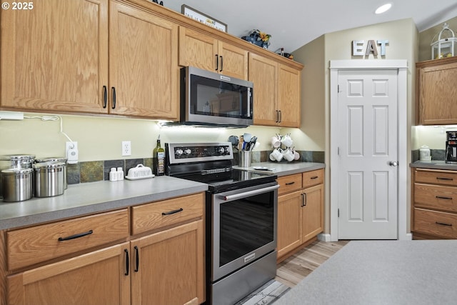 2057 SE Blue Skies Ln, Prineville, OR 97754 - kitchen with appliances with stainless steel finishes, light wood-style floors, light countertops, and recessed lighting