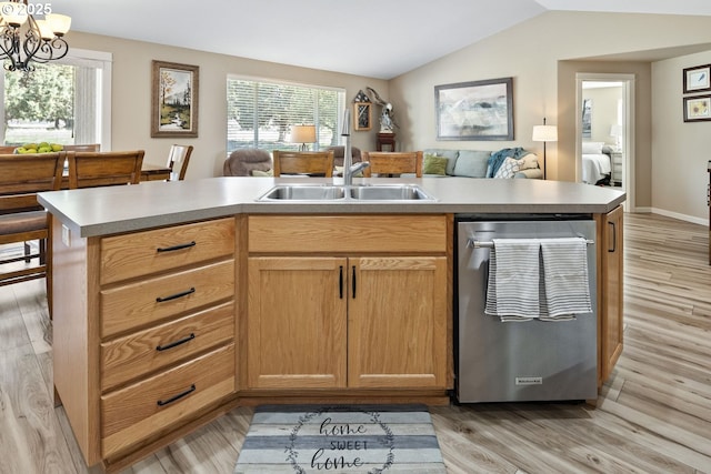 2057 SE Blue Skies Ln, Prineville, OR 97754 - kitchen with dishwasher, vaulted ceiling, light wood finished floors, open floor plan, and a sink