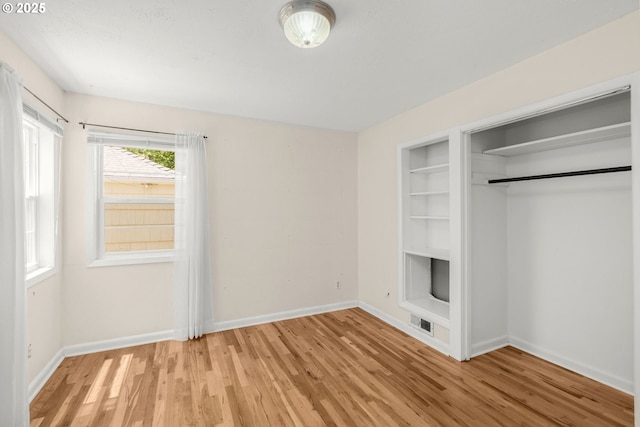 6105 NE 18th Ave, Portland, OR 97211 - unfurnished bedroom with light wood-style flooring and baseboards