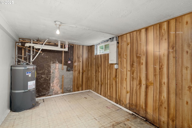 6105 NE 18th Ave, Portland, OR 97211 - basement featuring secured water heater, tile patterned floors, wood walls, and electric panel