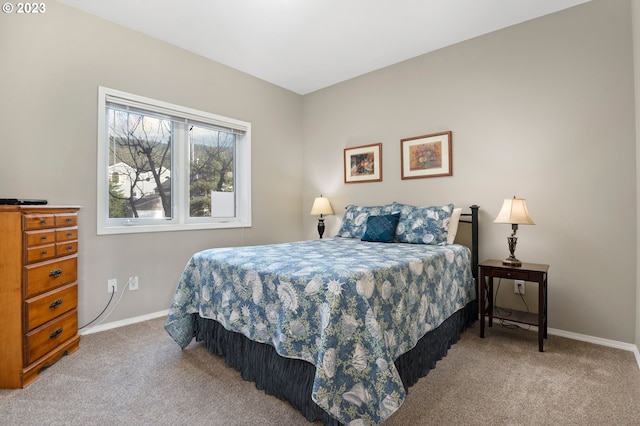 bedroom featuring light colored carpet