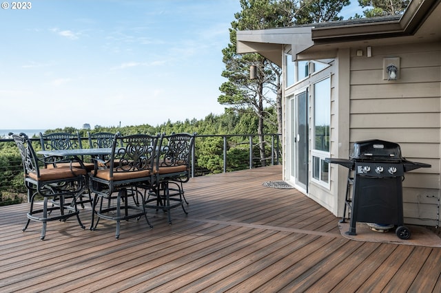 wooden terrace with a grill