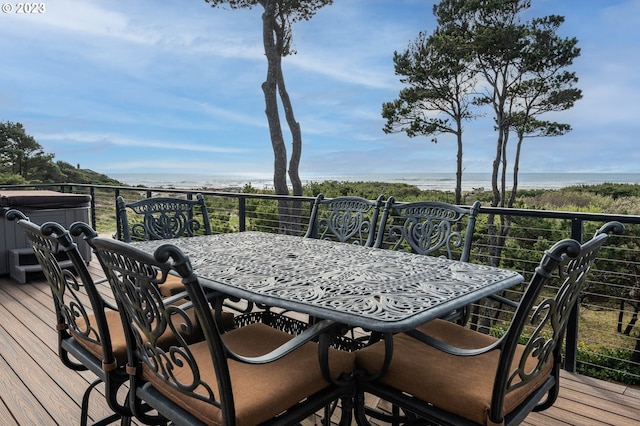 wooden terrace featuring a water view