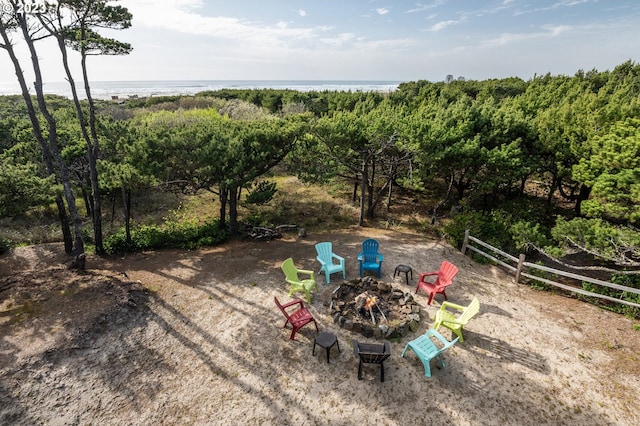 view of yard featuring an outdoor fire pit