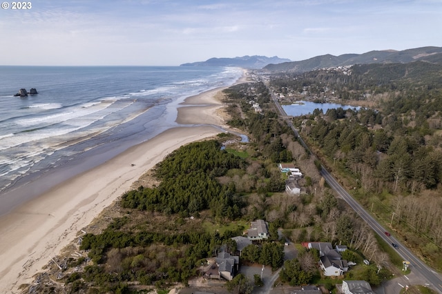 aerial view featuring a water view and a beach view