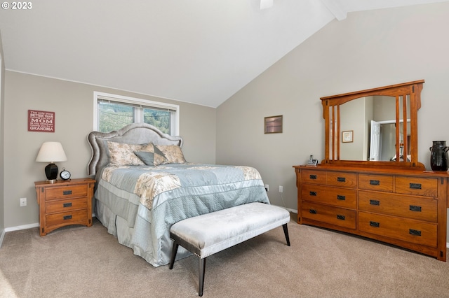 carpeted bedroom featuring lofted ceiling