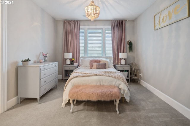 carpeted bedroom featuring a notable chandelier