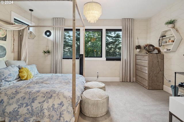 carpeted bedroom with a chandelier