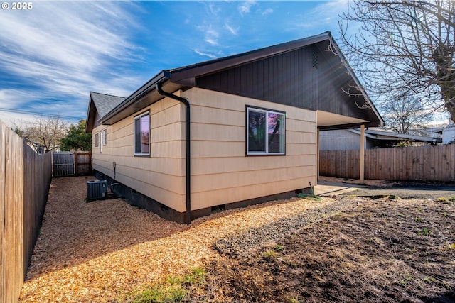 view of home's exterior featuring central AC, crawl space, and a fenced backyard