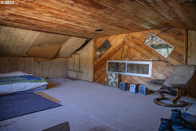 interior space with lofted ceiling, wood walls, and wooden ceiling