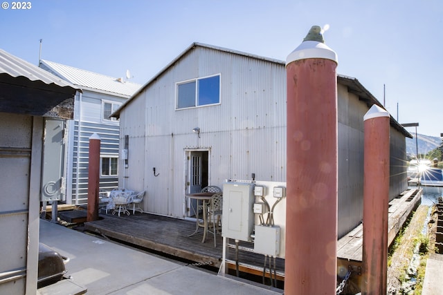 back of house featuring a wooden deck