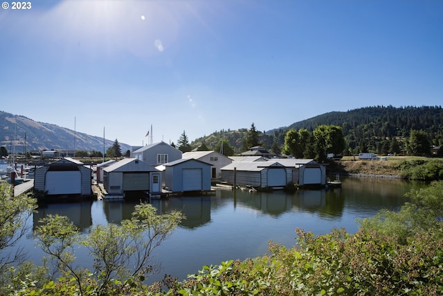 dock area featuring a water and mountain view