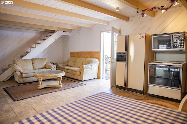 tiled living room featuring wooden walls and beamed ceiling