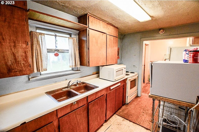 kitchen with sink and white appliances