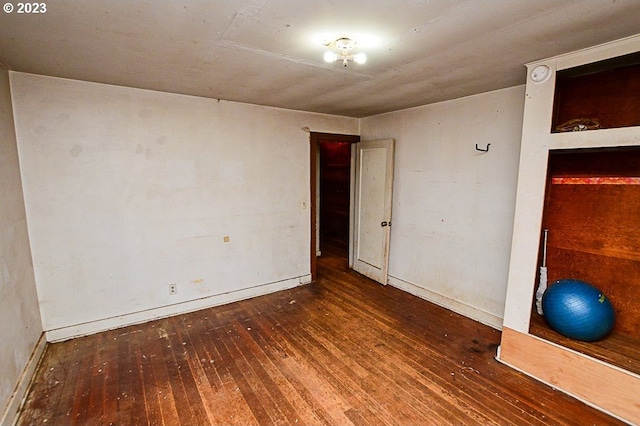 spare room with dark hardwood / wood-style floors