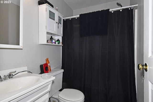 bathroom featuring toilet and vanity