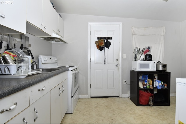 laundry area with light tile patterned floors