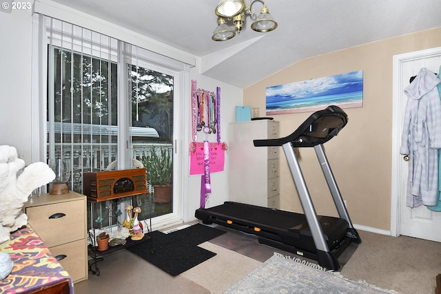 workout area featuring carpet flooring, lofted ceiling, and a chandelier