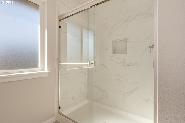 bathroom with an enclosed shower