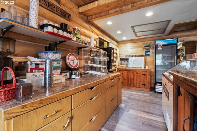 363 S Mill St, Sumpter, OR 97877 - kitchen with wooden walls, double wall oven, and light hardwood / wood-style flooring