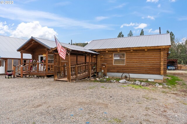 363 S Mill St, Sumpter, OR 97877 - rear view of property with a wooden deck