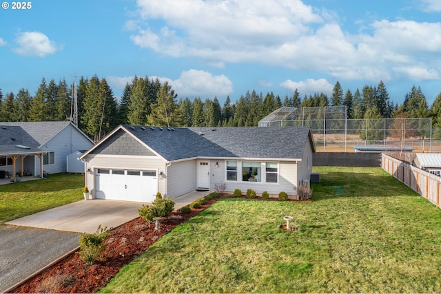 single story home with roof with shingles, concrete driveway, a front yard, fence, and a garage