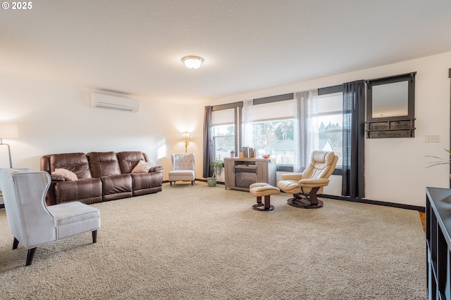 living room with carpet, a wall mounted air conditioner, and baseboards