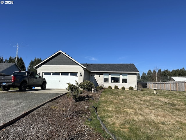 view of front of home featuring an attached garage, fence, aphalt driveway, and a front yard