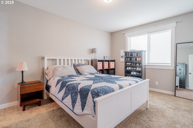 carpeted bedroom with baseboards