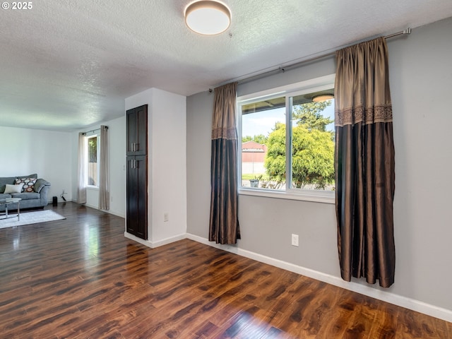 10204 NE 6th Ave, Vancouver, WA 98685 - empty room with a textured ceiling and dark wood finished floors