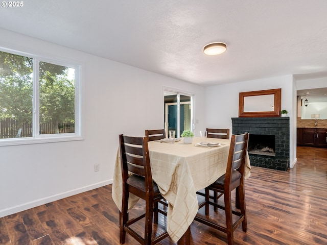 10204 NE 6th Ave, Vancouver, WA 98685 - dining space with dark wood-style floors and a fireplace
