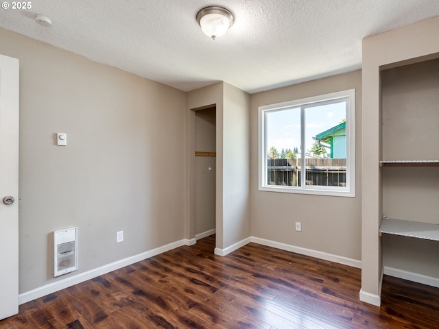 10204 NE 6th Ave, Vancouver, WA 98685 - unfurnished bedroom with heating unit, wood finished floors, and a textured ceiling