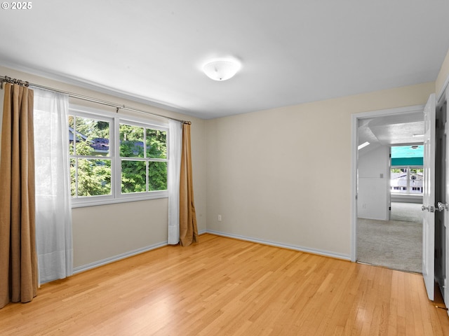 1209 Lake Garden Ct, Lake Oswego, OR 97034 - spare room with light wood-type flooring, healthy amount of natural light, and baseboards