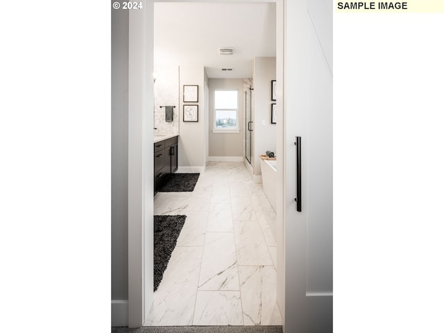 hallway featuring light tile patterned flooring