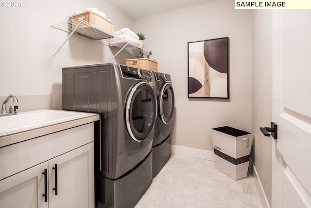 washroom with light tile patterned flooring and independent washer and dryer