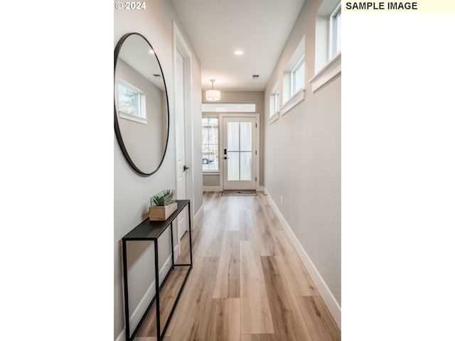 hallway featuring light hardwood / wood-style floors