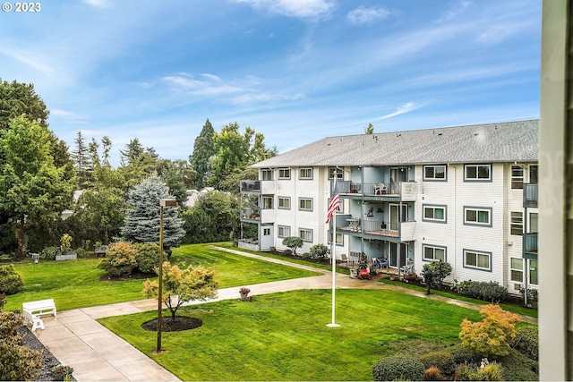 view of property's community with a lawn